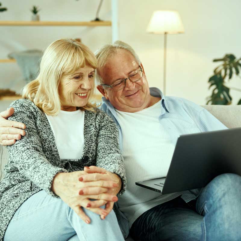 Elderly couple exploring equity release through a reverse mortgage in NC