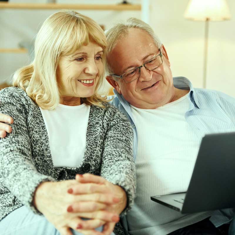 Family discussing home sale after a reverse mortgage borrower’s passing